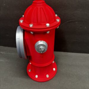 Red fire hydrant model with silver bolts and a silver side cap, shown upright on a gray surface against a dark gray background.