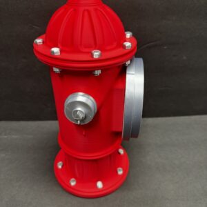 Bright red fire hydrant with silver bolt heads and a silver side nozzle cap standing on a gray surface against a dark gray background.