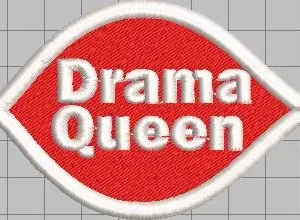 Red embroidered patch shaped like a stylized lip or leaf with a white stitched border and bold white embroidered text reading "Drama Queen" over a light grey grid background